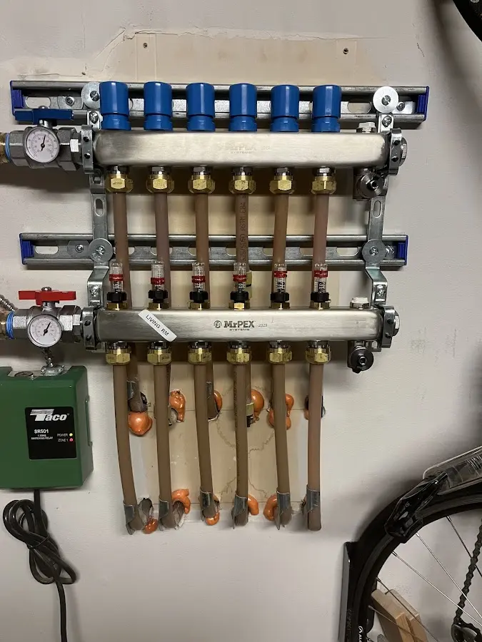 Plumber performing Water Heater Repair at a residential property in Crete